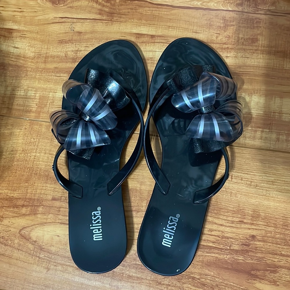 Melissa black flip flops